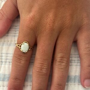 This is a 10K solid gold oval opal ring in a size 6!